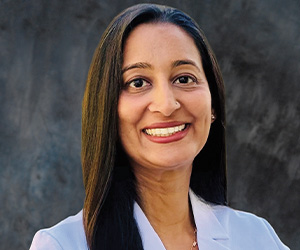 Dr Dhesi